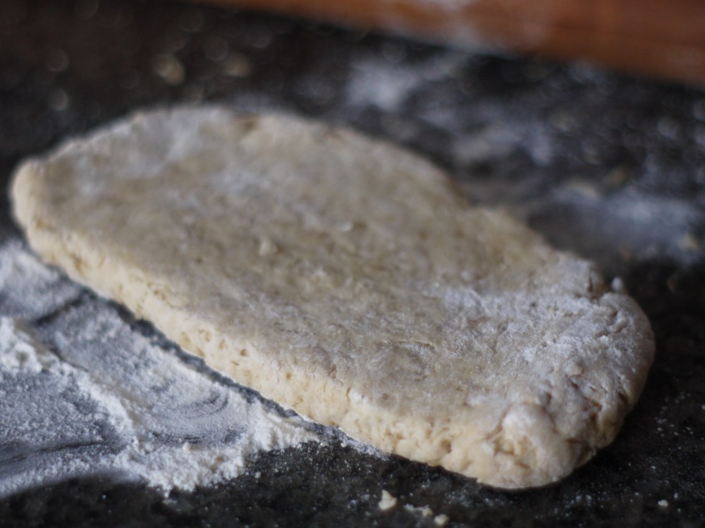 rolling out biscuits
